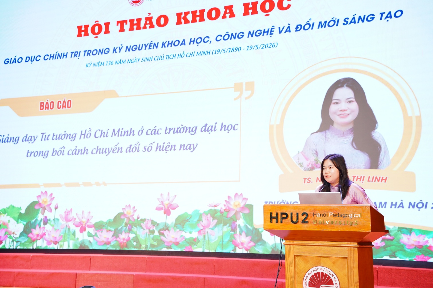 A person standing at a podium
Description automatically generated