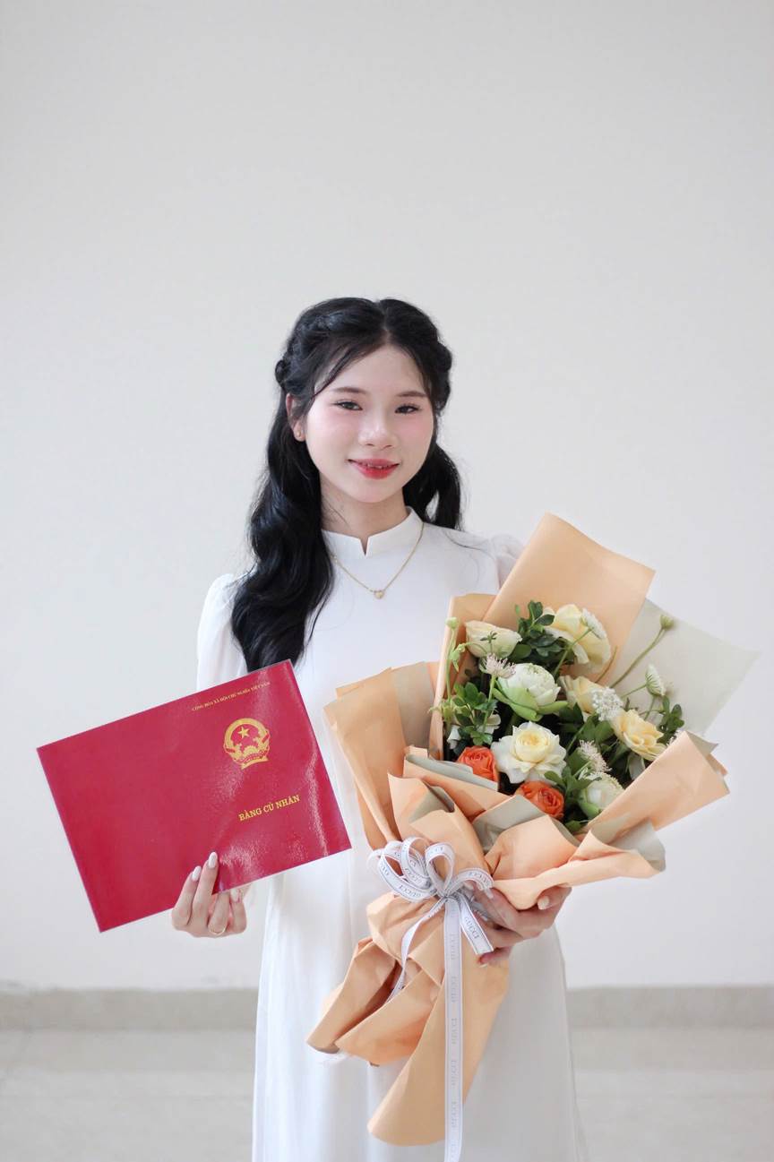 A person holding flowers and a red book

AI-generated content may be incorrect.
